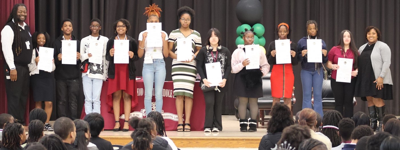 students holding certificates