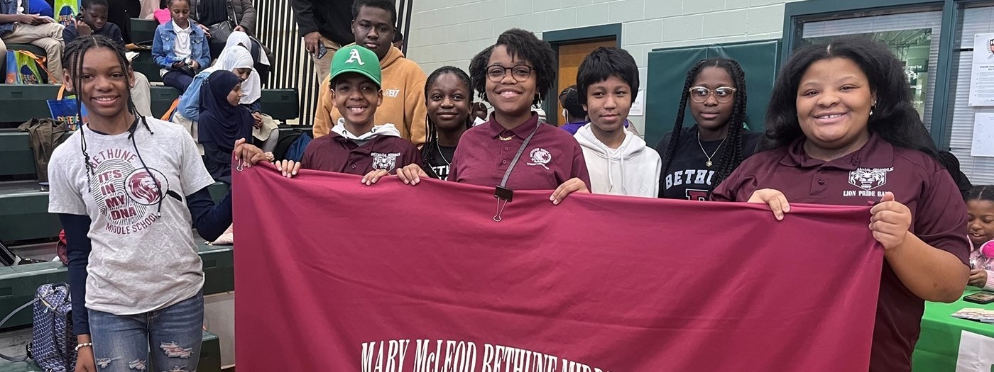 Students holding banner